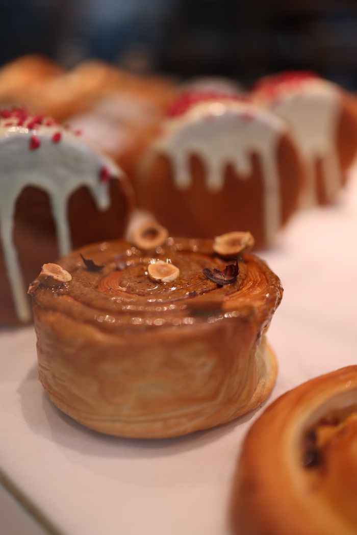 Close-up of decorated pastries with icing, beautifully arranged as a snack.